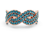 Pavé Round Blue Topaz Infinity Twist Band in Rose gold with Shared Prong Setting