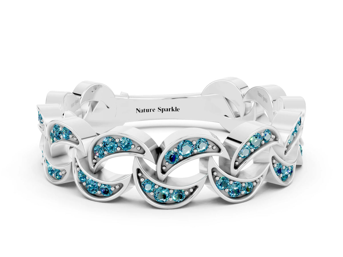 Pavé Round Blue Topaz Interlocking Eternity Band in Platinum with Bezel Prong Setting