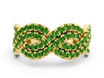 Pavé Round Peridot Infinity Twist Band in Yellow gold with Shared Prong Setting