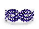 Pavé Round Tanzanite Infinity Twist Band in Silver with Shared Prong Setting