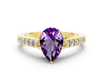 Pear Cut Amethyst Solitaire Ring in Yellow gold with Crossover Gallery and Round Pavé Band