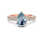 Pear Cut Aquamarine Pavé Solitaire Ring in Rose gold with Round Pavé Band and Prong Setting