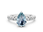 Pear Cut Aquamarine Pavé Solitaire Ring in Silver with Round Pavé Band and Prong Setting