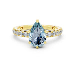 Pear Cut Aquamarine Pavé Solitaire Ring in Yellow gold with Round Pavé Band and Prong Setting