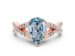 Pear Cut Aquamarine Solitaire Ring in Rose gold with Interwoven Pavé Band and Prong Setting