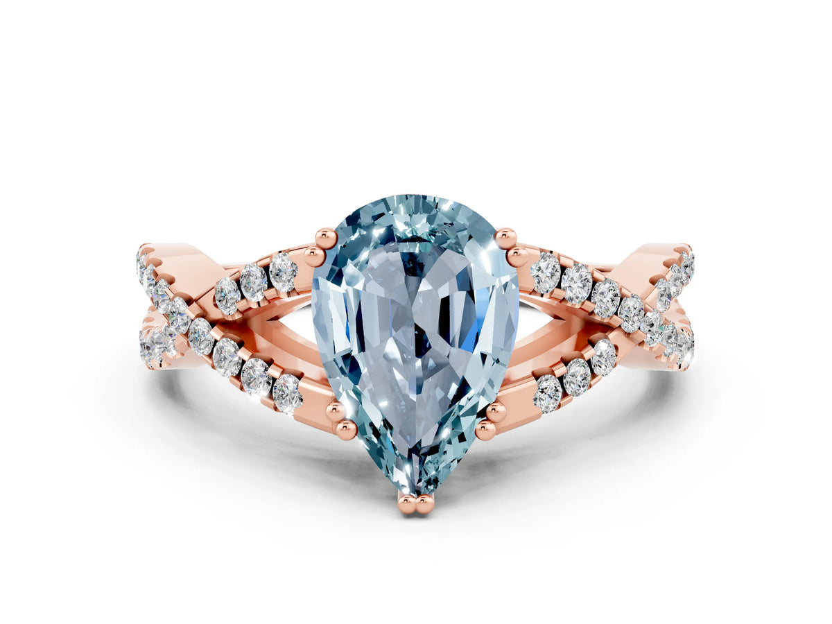 Pear Cut Aquamarine Solitaire Ring in Rose gold with Interwoven Pavé Band and Prong Setting