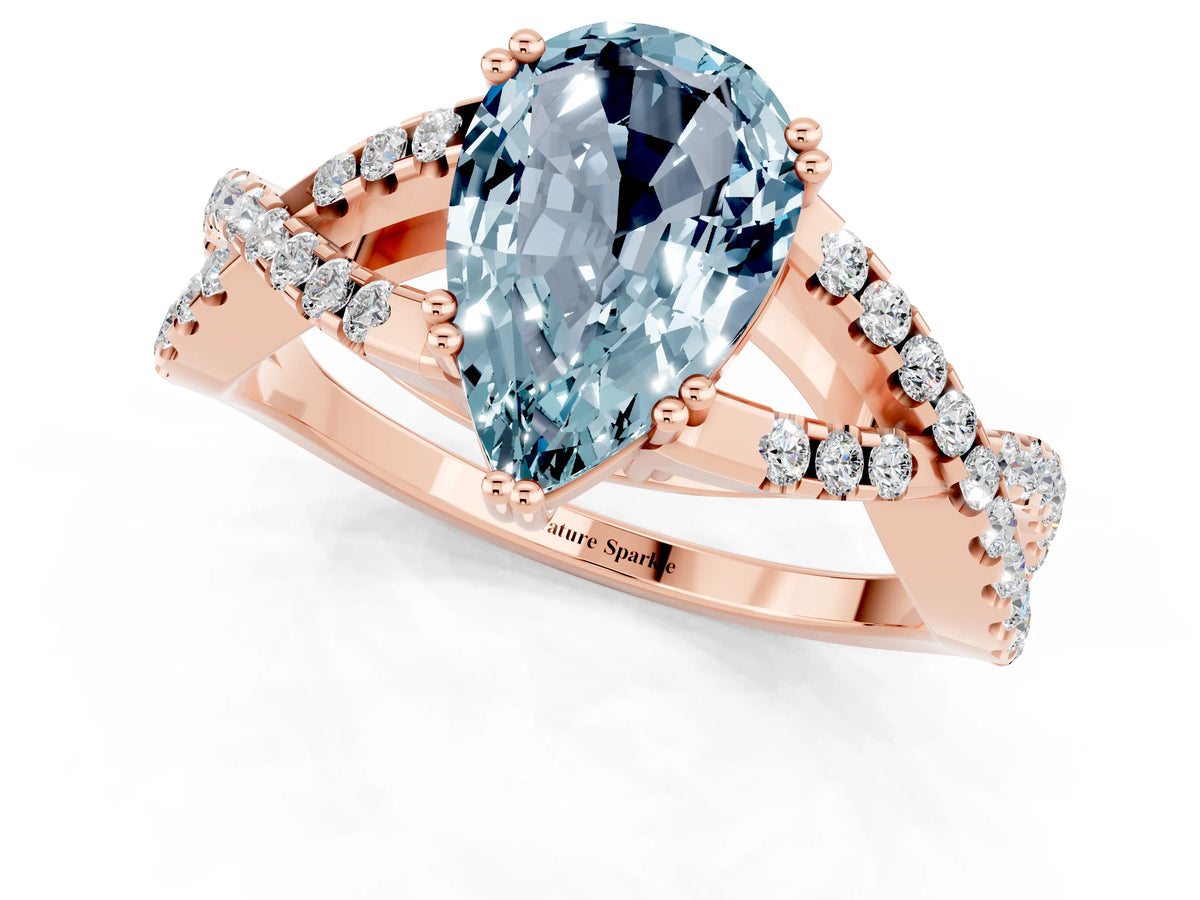 Pear Cut Aquamarine Solitaire Ring in Rose gold with Interwoven Pavé Band and Prong Setting_1