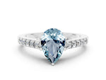 Pear Cut Aquamarine Solitaire Ring in White gold with Crossover Gallery and Round Pavé Band