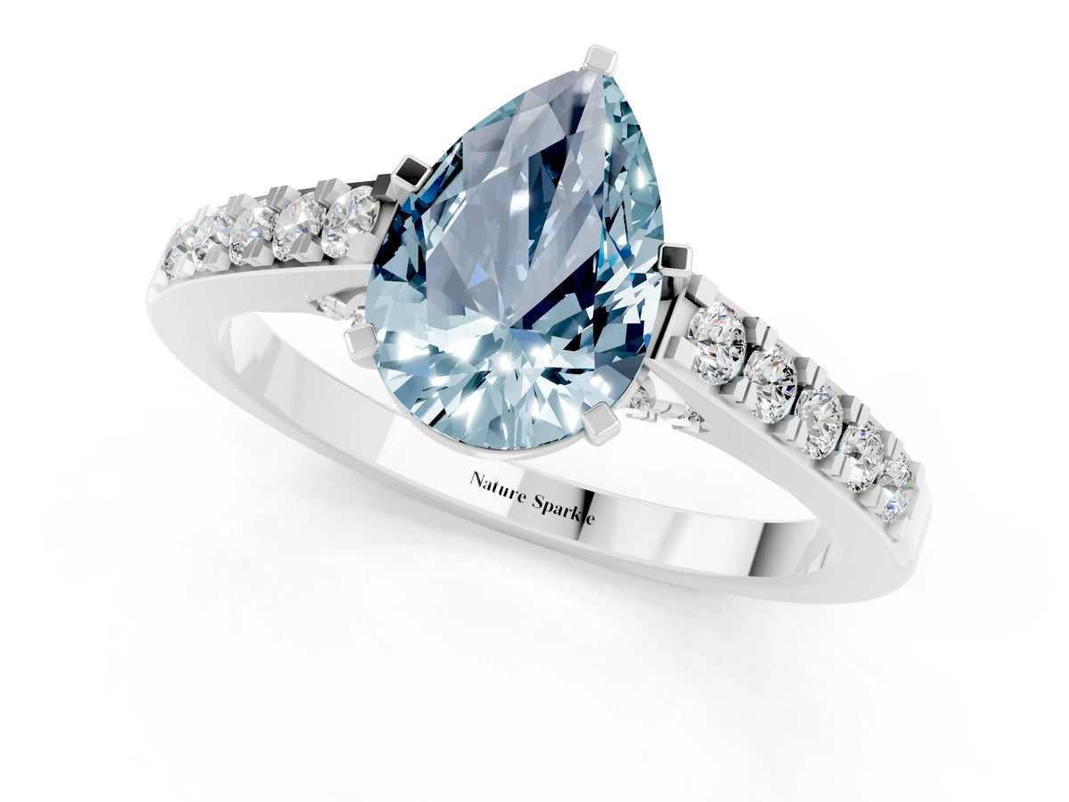 Pear Cut Aquamarine Solitaire Ring in White gold with Crossover Gallery and Round Pavé Band_1