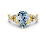 Pear Cut Aquamarine Solitaire Ring in Yellow gold with Interwoven Pavé Band and Prong Setting