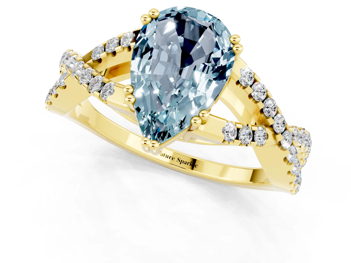 Pear Cut Aquamarine Solitaire Ring in Yellow gold with Interwoven Pavé Band and Prong Setting_1