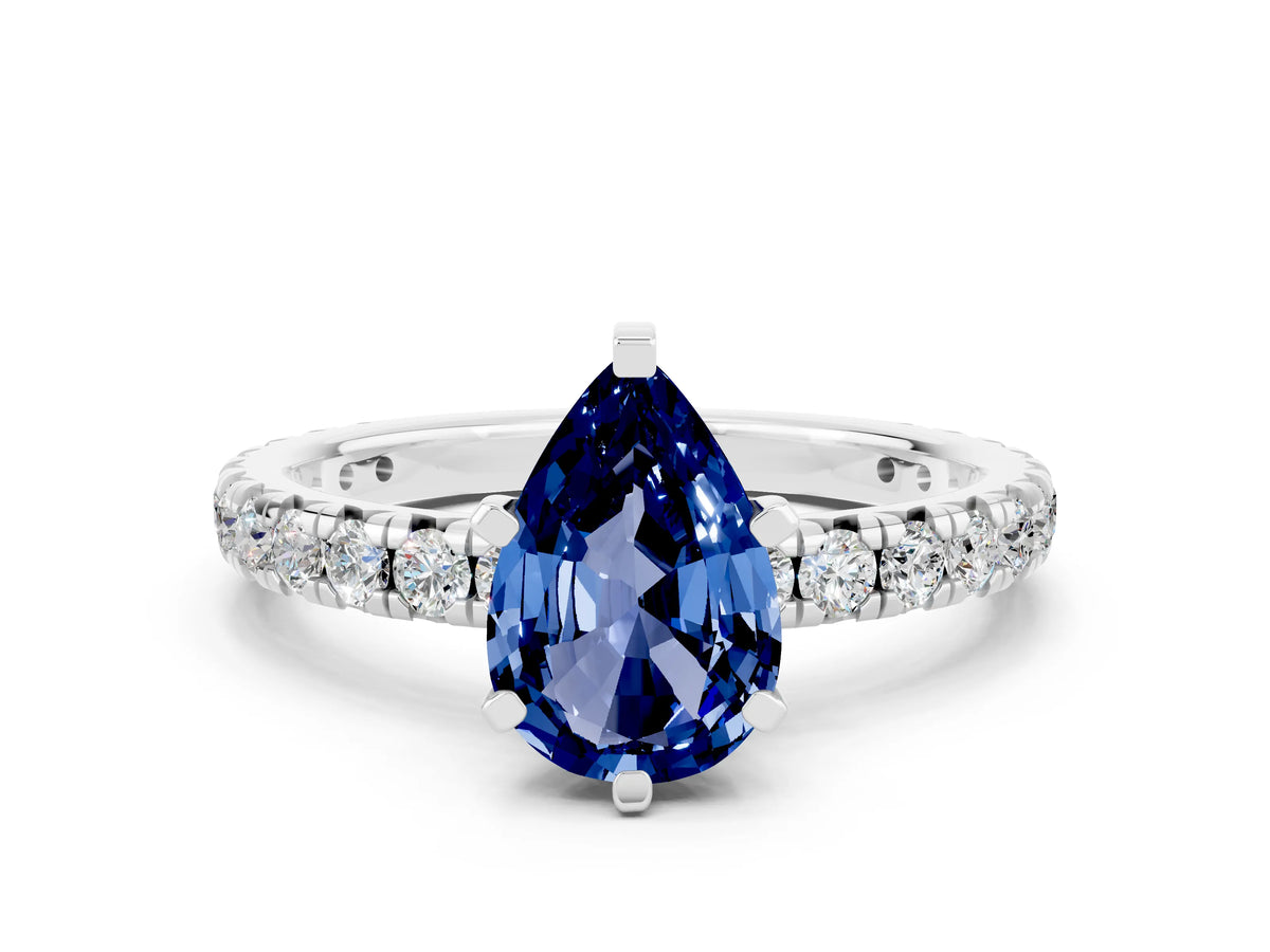 Pear Cut Blue Sapphire Pavé Solitaire Ring in White gold with Round Pavé Band and Prong Setting