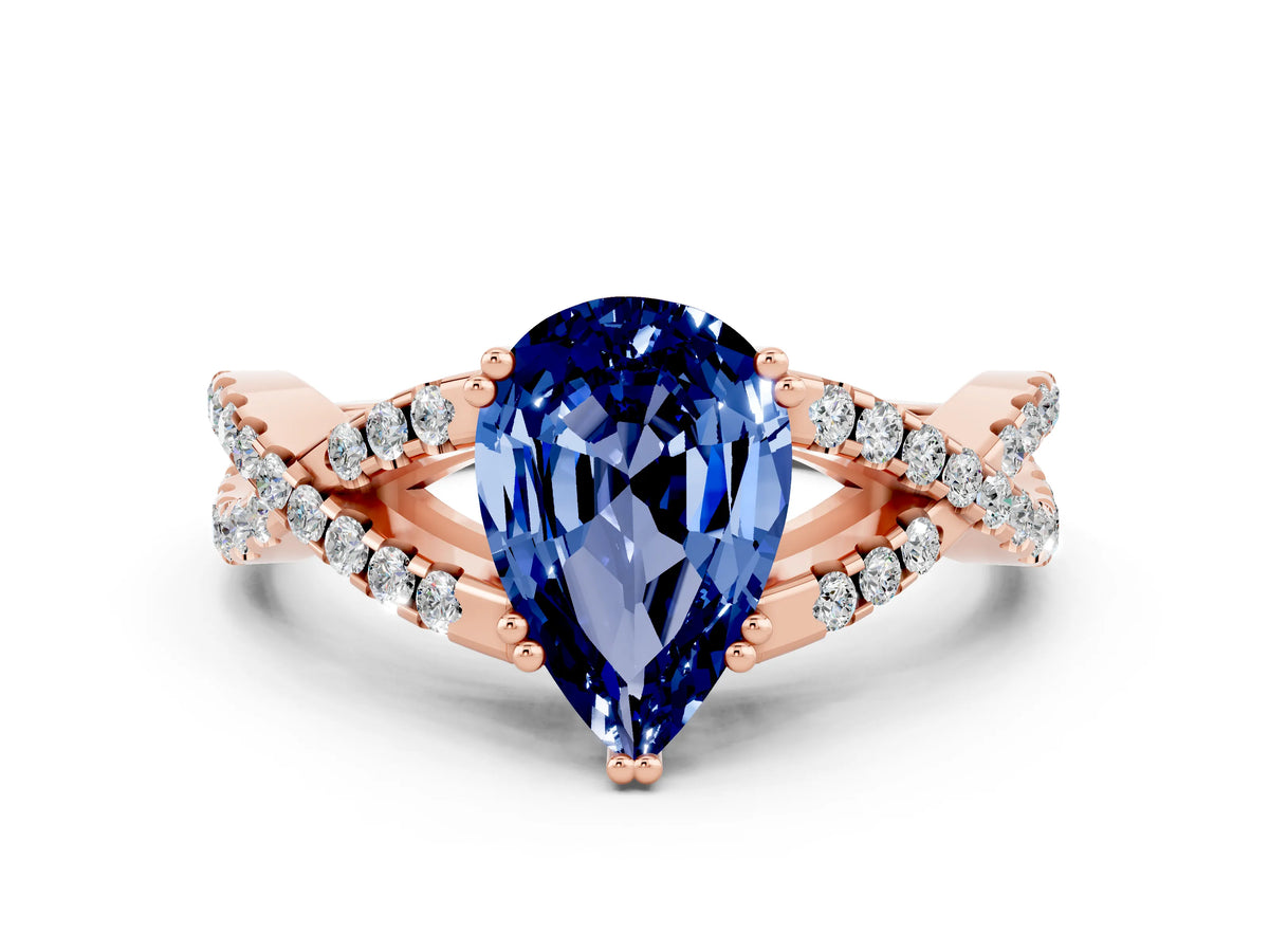 Pear Cut Blue Sapphire Solitaire Ring in Rose gold with Interwoven Pavé Band and Prong Setting