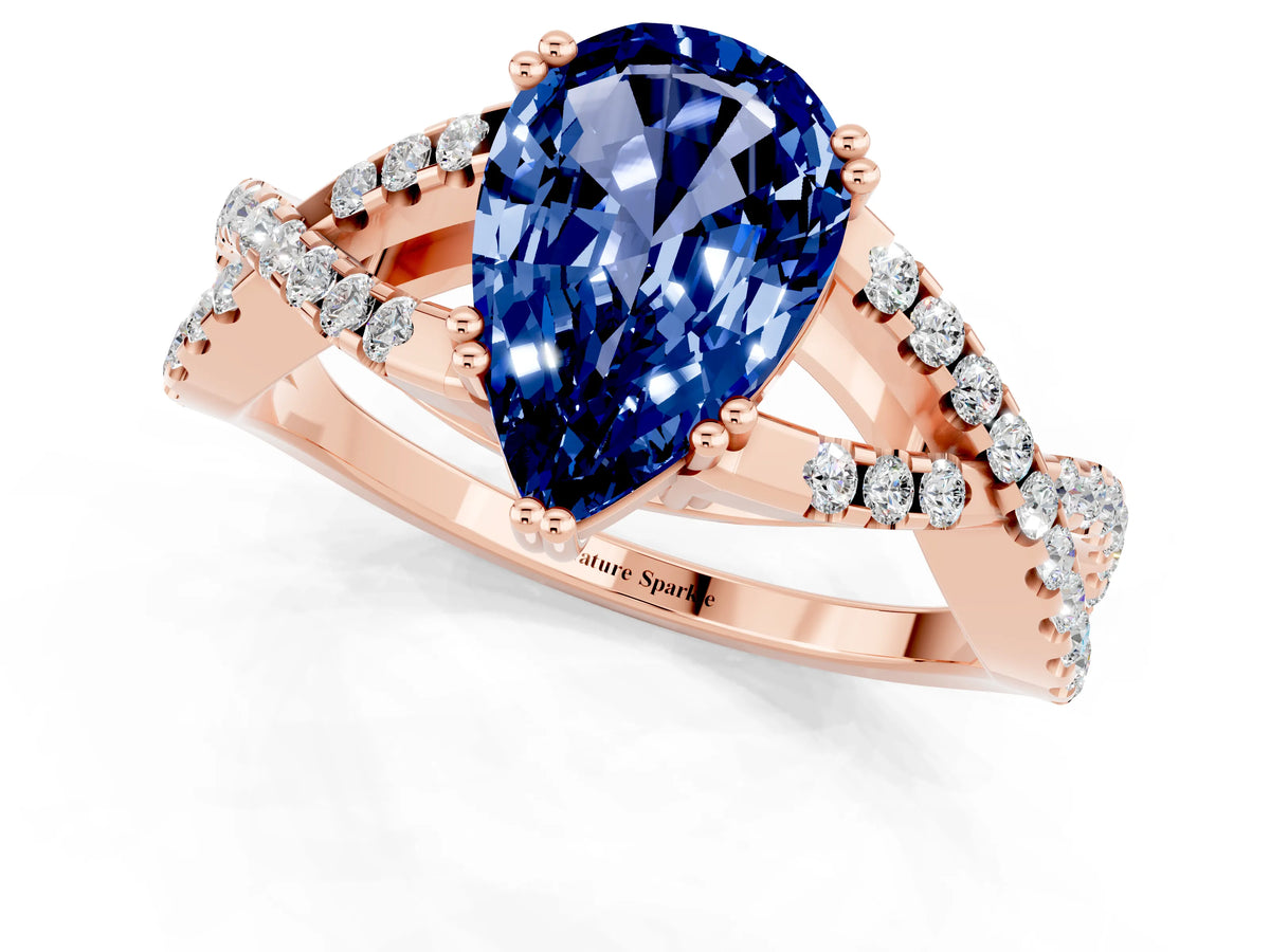 Pear Cut Blue Sapphire Solitaire Ring in Rose gold with Interwoven Pavé Band and Prong Setting_1