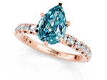 Pear Cut Blue Topaz Pavé Solitaire Ring in Rose gold with Round Pavé Band and Prong Setting_1