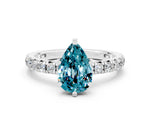 Pear Cut Blue Topaz Pavé Solitaire Ring in White gold with Round Pavé Band and Prong Setting