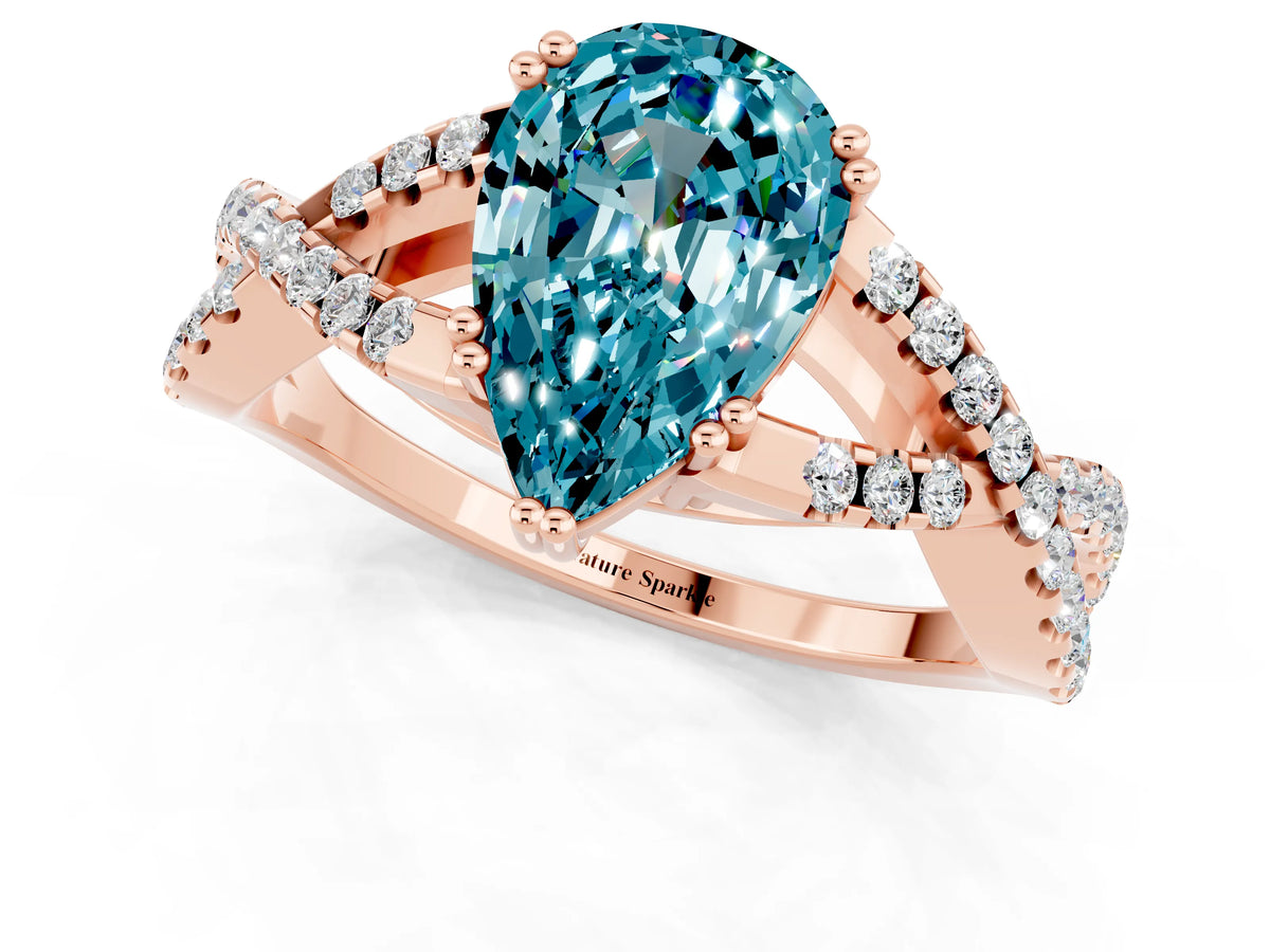 Pear Cut Blue Topaz Solitaire Ring in Rose gold with Interwoven Pavé Band and Prong Setting_1