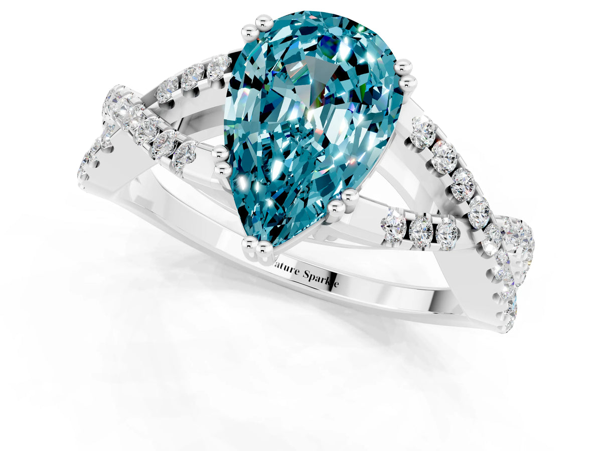 Pear Cut Blue Topaz Solitaire Ring in White gold with Interwoven Pavé Band and Prong Setting_1