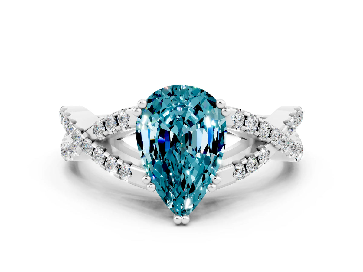 Pear Cut Blue Topaz Solitaire Ring in White gold with Interwoven Pavé Band and Prong Setting