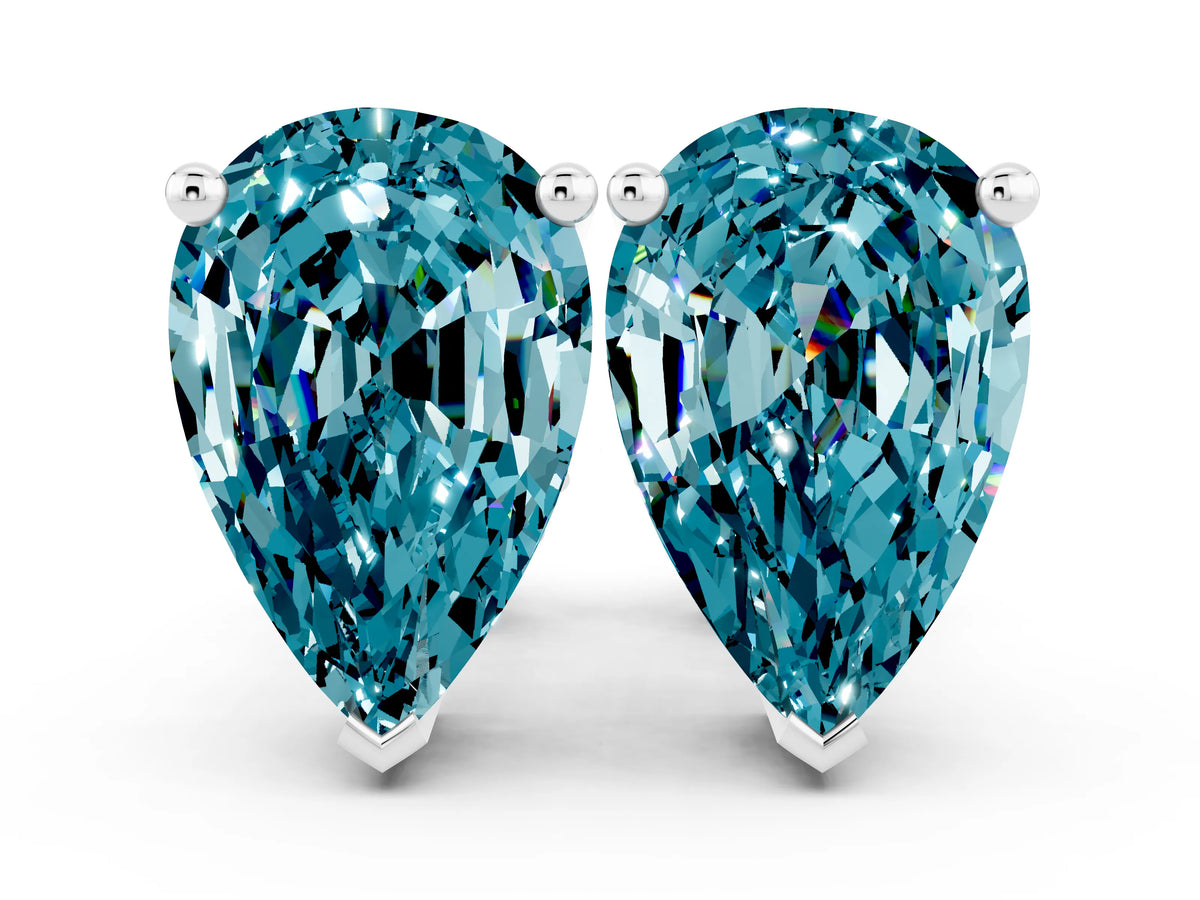 Pear Cut Blue Topaz Stud Earrings in White gold with Basket Setting