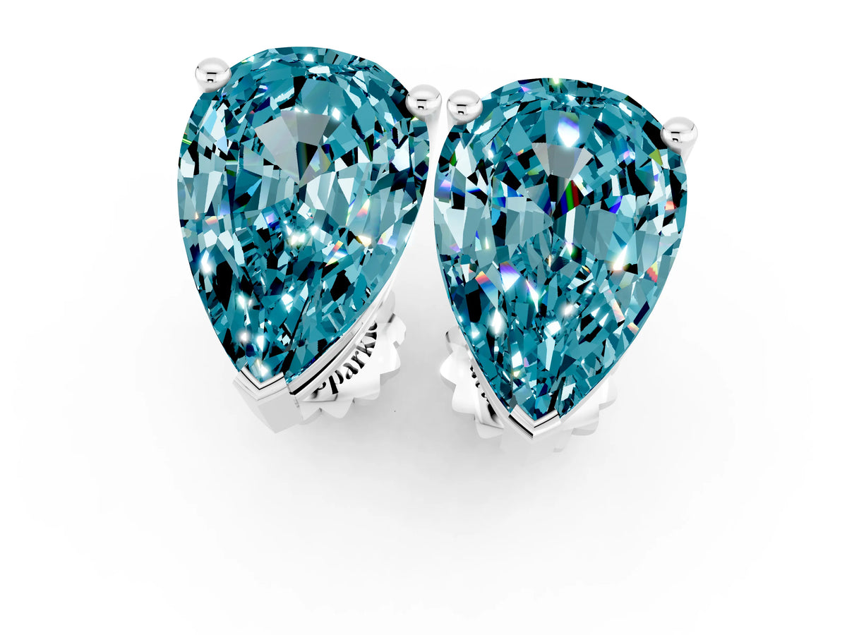 Pear Cut Blue Topaz Stud Earrings in White gold with Basket Setting_1