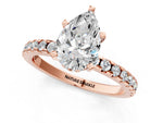 Pear Cut Diamond Hidden Halo Solitaire Ring in Rose gold with Round Pavé Band and Prong Setting_25
