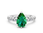 Pear Cut Emerald Pavé Solitaire Ring in White gold with Round Pavé Band and Prong Setting