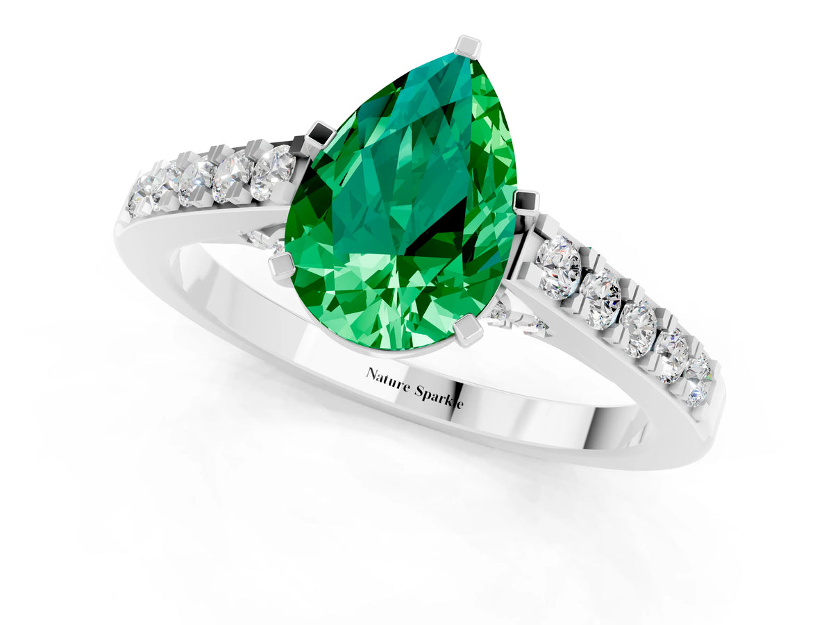 Pear Cut Emerald Solitaire Ring in Platinum with Crossover Gallery and Round Pavé Band_1