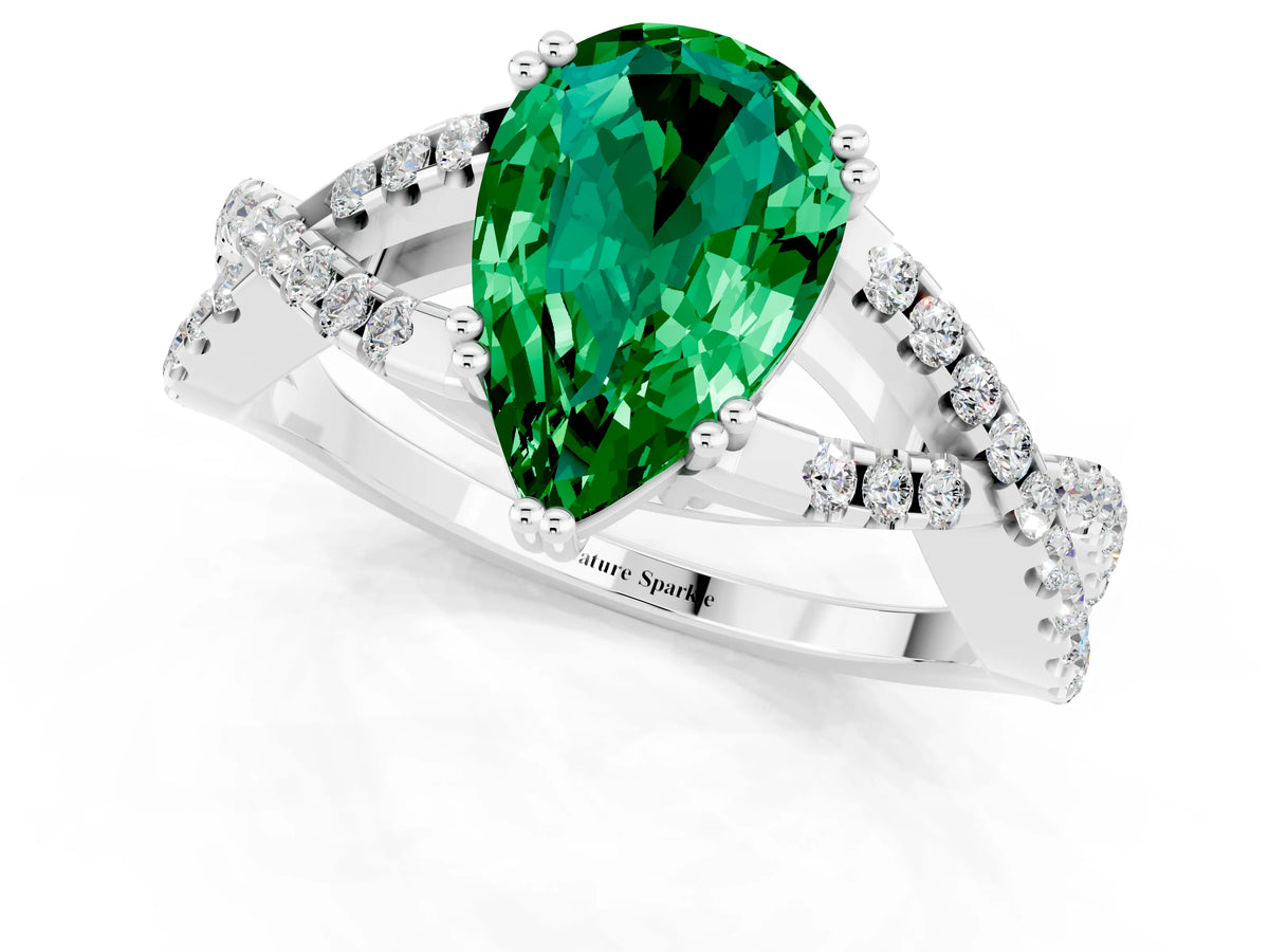 Pear Cut Emerald Solitaire Ring in Platinum with Interwoven Pavé Band and Prong Setting_7