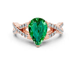 Pear Cut Emerald Solitaire Ring in Rose gold with Interwoven Pavé Band and Prong Setting