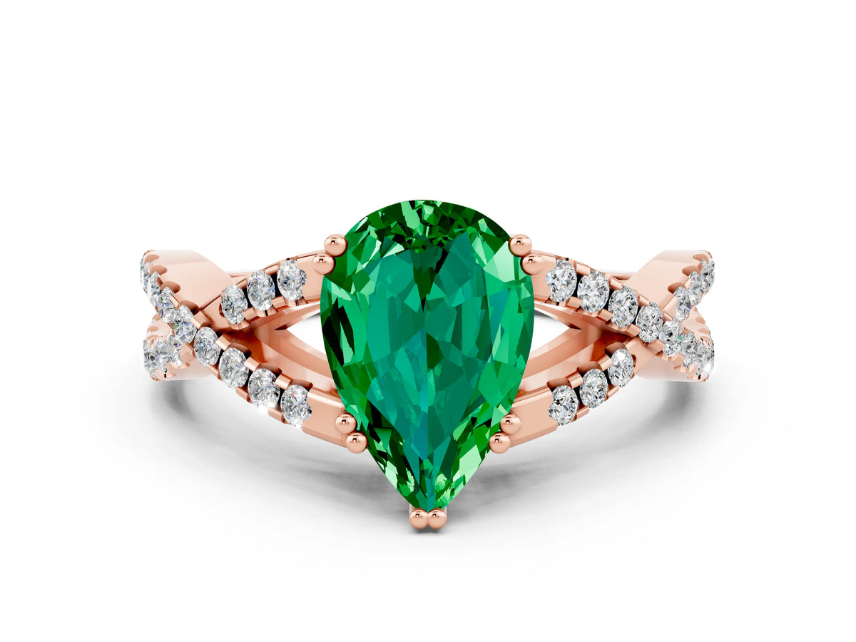 Pear Cut Emerald Solitaire Ring in Rose gold with Interwoven Pavé Band and Prong Setting