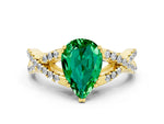 Pear Cut Emerald Solitaire Ring in Yellow gold with Interwoven Pavé Band and Prong Setting