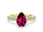 Pear Cut Garnet Pavé Solitaire Ring in Yellow gold with Round Pavé Band and Prong Setting