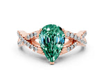 Pear Cut Green Sapphire Solitaire Ring in Rose gold with Interwoven Pavé Band and Prong Setting