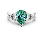 Pear Cut Green Sapphire Solitaire Ring in White gold with Interwoven Pavé Band and Prong Setting
