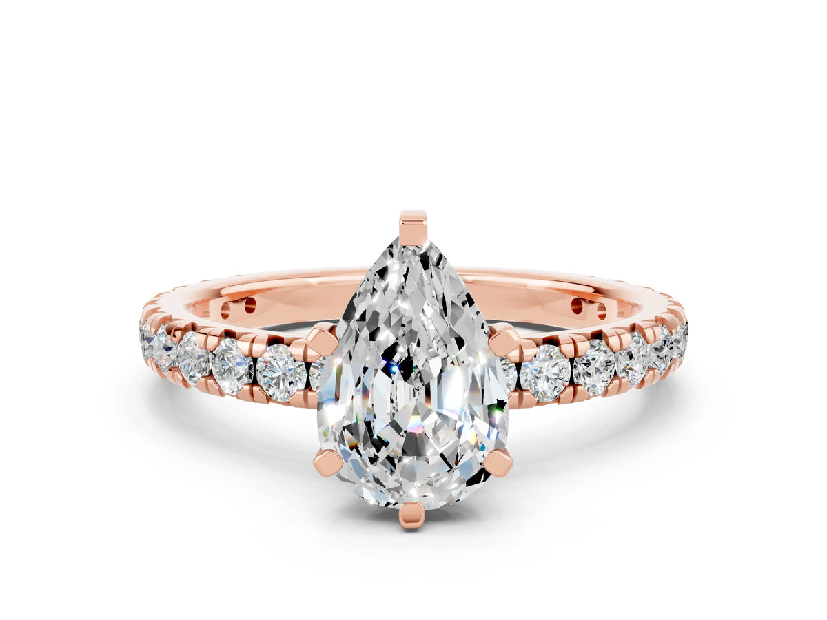 Pear Cut Moissanite Pavé Solitaire Ring in Rose gold with Round Pavé Band and Prong Setting
