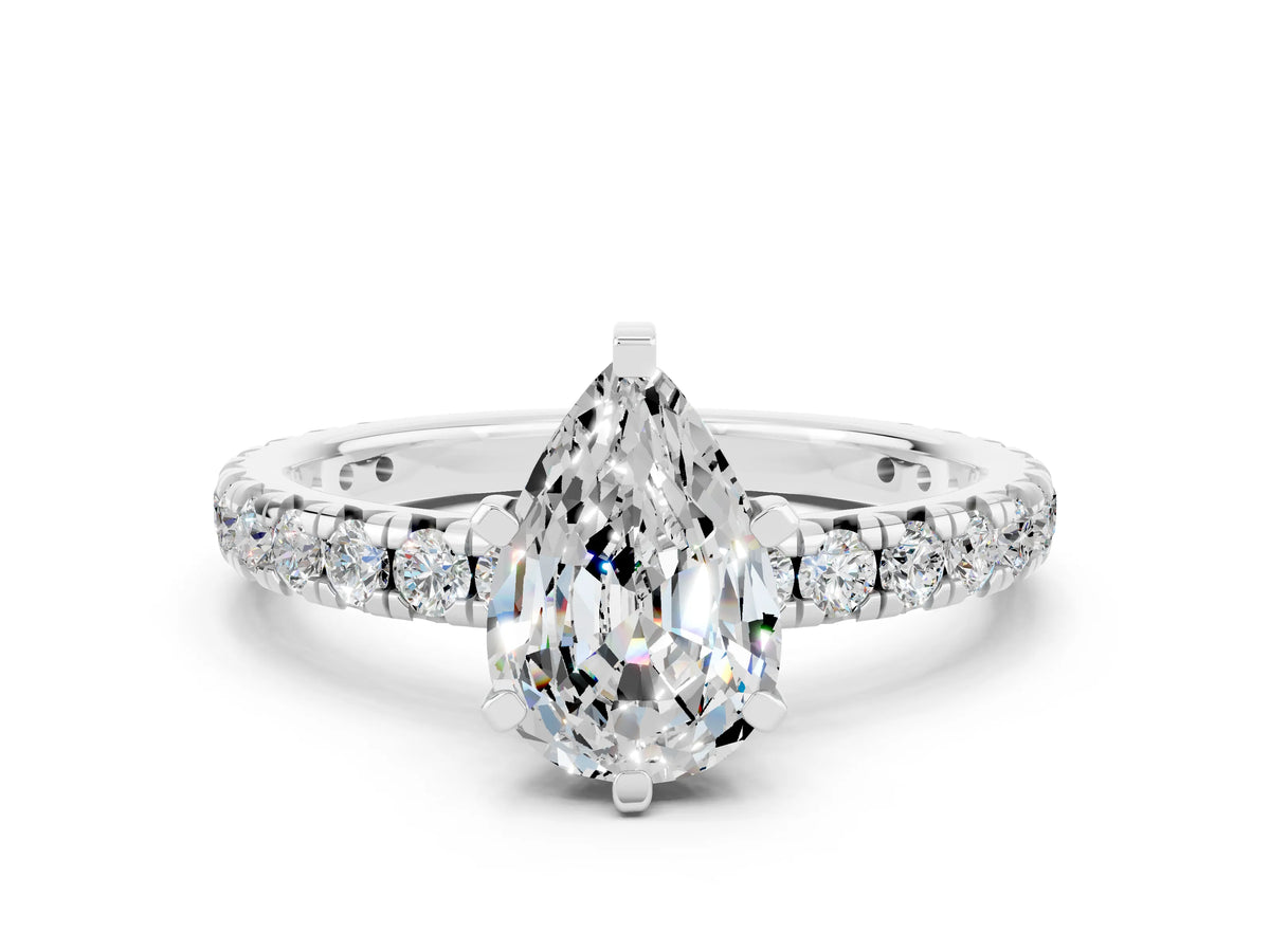 Pear Cut Moissanite Pavé Solitaire Ring in White gold with Round Pavé Band and Prong Setting