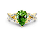 Pear Cut Peridot Solitaire Ring in Yellow gold with Interwoven Pavé Band and Prong Setting