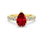 Pear Cut Ruby Pavé Solitaire Ring in Yellow gold with Round Pavé Band and Prong Setting