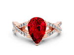 Pear Cut Ruby Solitaire Ring in Rose gold with Interwoven Pavé Band and Prong Setting