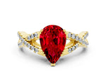 Pear Cut Ruby Solitaire Ring in Yellow gold with Interwoven Pavé Band and Prong Setting