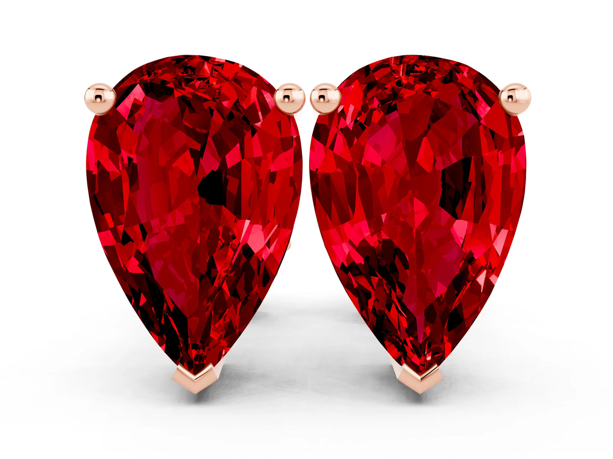 Pear Cut Ruby Stud Earrings in Rose gold with Basket Setting
