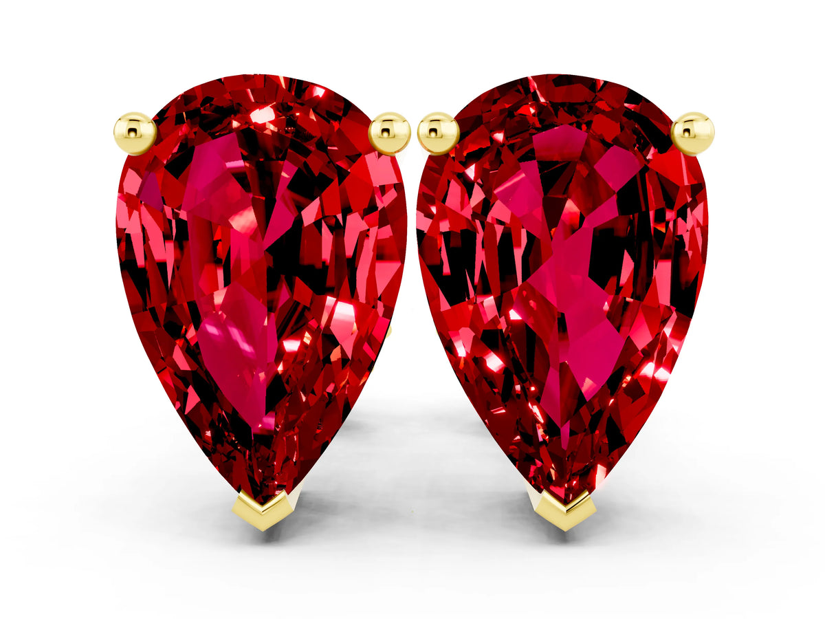 Pear Cut Ruby Stud Earrings in Yellow gold with Basket Setting