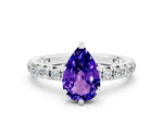 Pear Cut Tanzanite Pavé Solitaire Ring in Silver with Round Pavé Band and Prong Setting