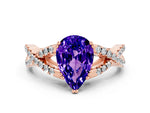 Pear Cut Tanzanite Solitaire Ring in Rose gold with Interwoven Pavé Band and Prong Setting