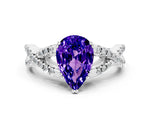 Pear Cut Tanzanite Solitaire Ring in White gold with Interwoven Pavé Band and Prong Setting