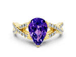 Pear Cut Tanzanite Solitaire Ring in Yellow gold with Interwoven Pavé Band and Prong Setting