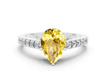 Pear Cut Yellow Sapphire Solitaire Ring in White gold with Crossover Gallery and Round Pavé Band