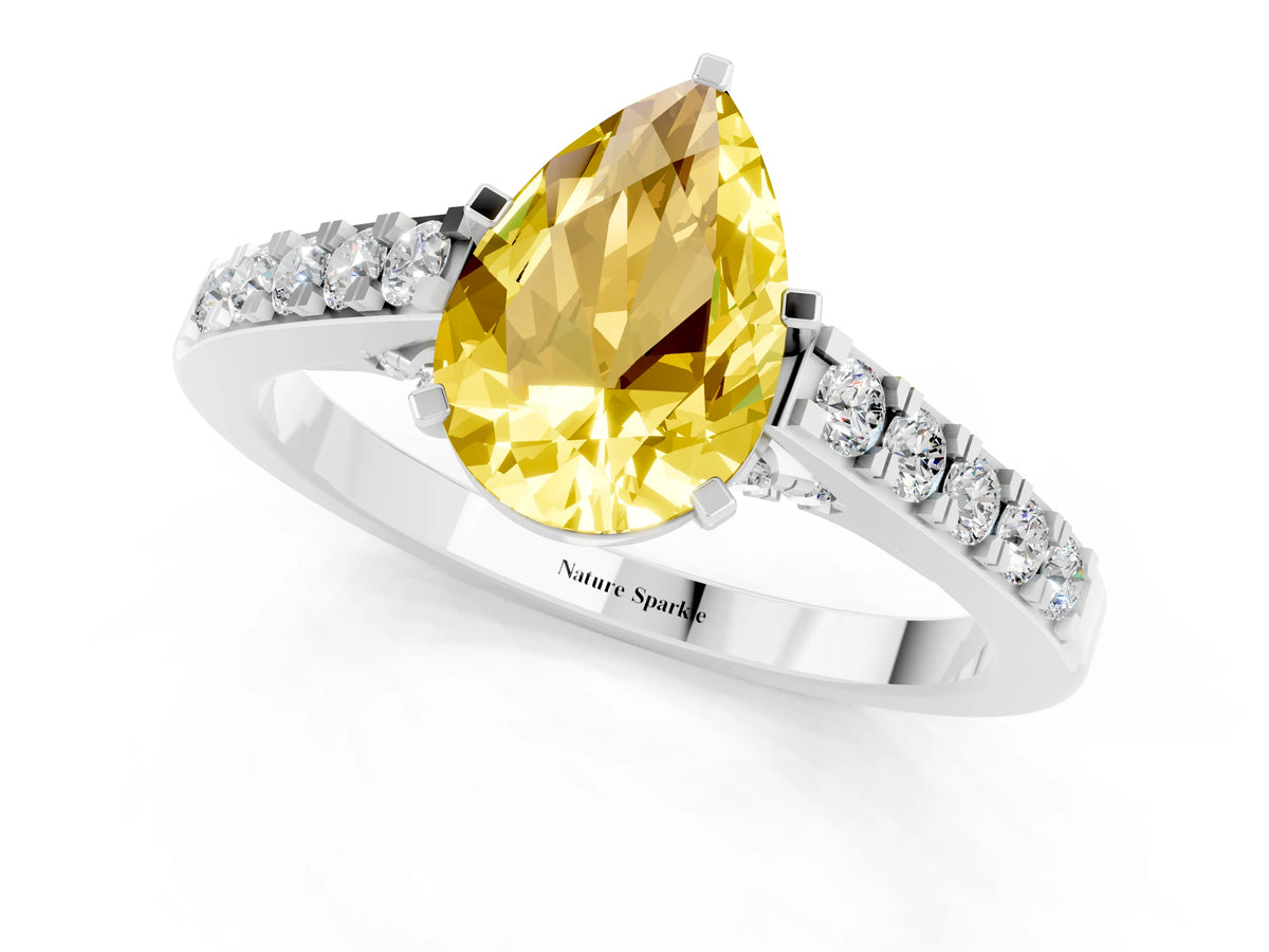 Pear Cut Yellow Sapphire Solitaire Ring in White gold with Crossover Gallery and Round Pavé Band_1