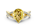 Pear Cut Yellow Sapphire Solitaire Ring in Yellow gold with Interwoven Pavé Band and Prong Setting